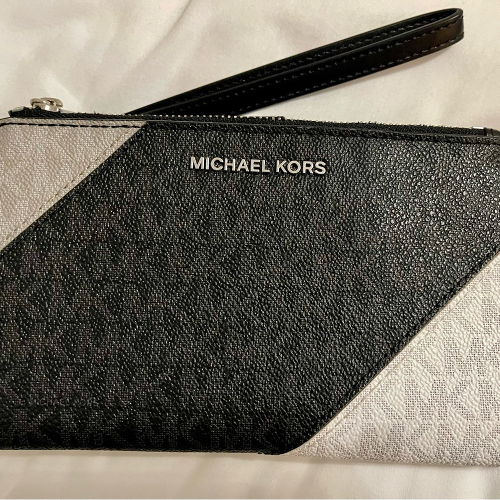 Authentic Michael Kors tri color smartphone wristlet wallet.